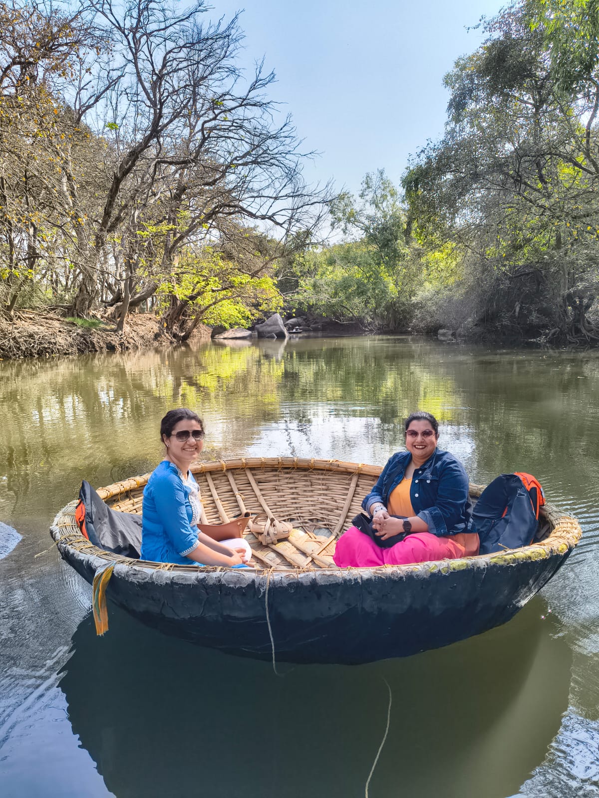 Sonapur Lake boat ride Hampi — group of tourists in coracle with Rakesh tour